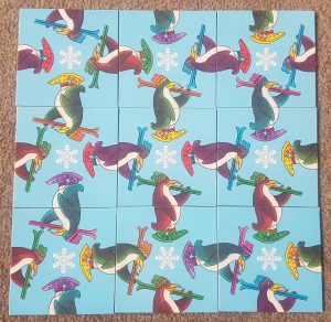 A puzzle with different coloured penguins.